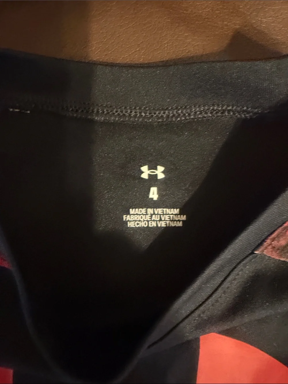 Under Armour Black Tee with Red Logo and Red Patterned Sleeves